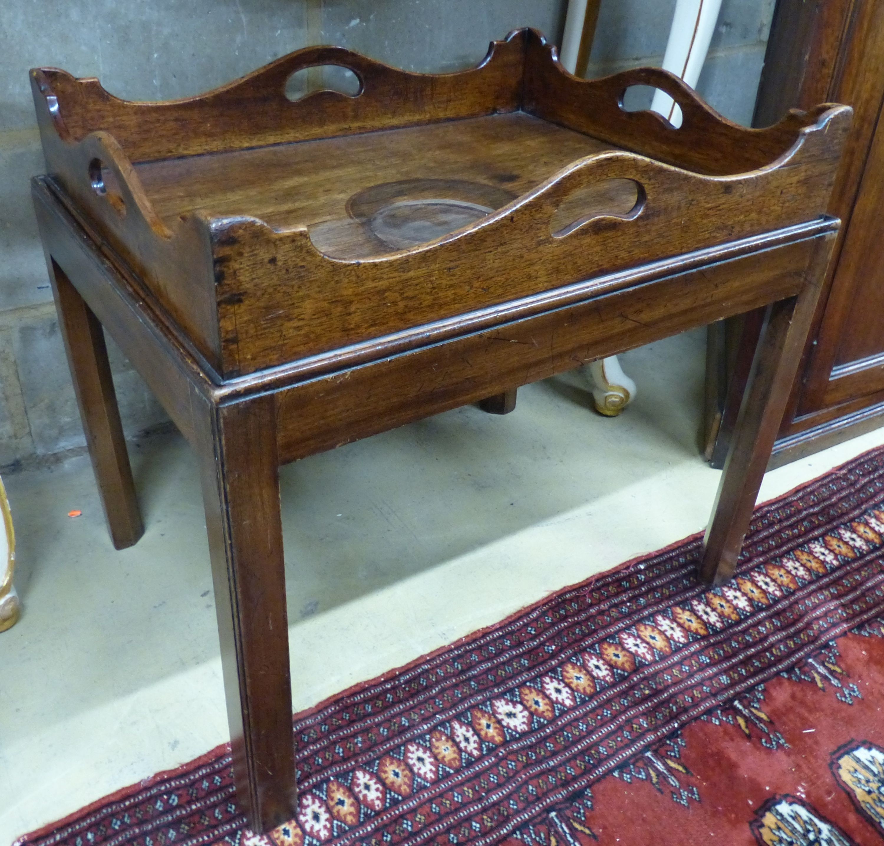 A 19th century rectangular mahogany butler’s tray occasional table, on associated stand, W.64cm D.49cm H.58cm (a.f.)